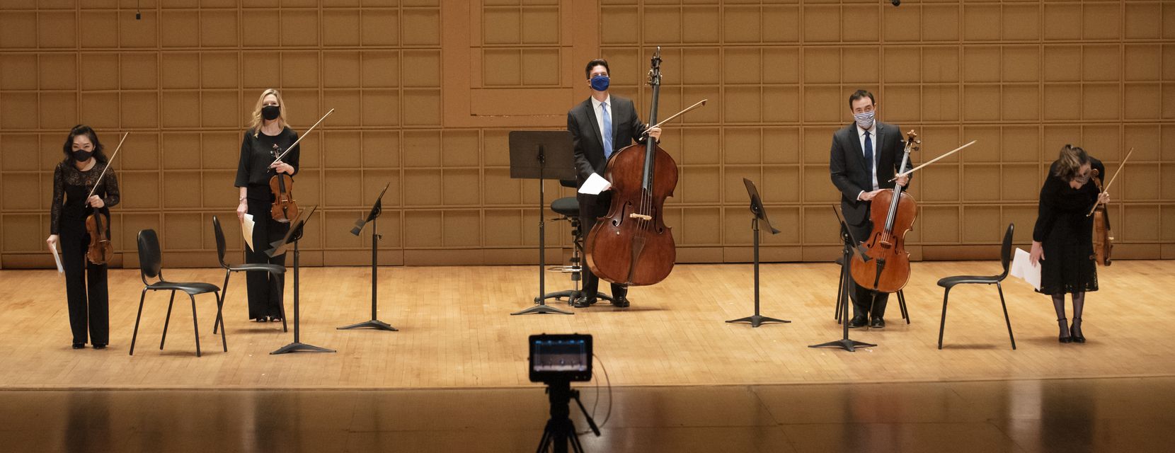 Members of the Dallas Symphony Orchestra were introduced for a video recording before performing George Walker's Lyric for Strings at the Morton H. Meyerson Symphony Center in Dallas on June 13. The recording was done to bring the sounds of the DSO to people's homes during the coronavirus pandemic.