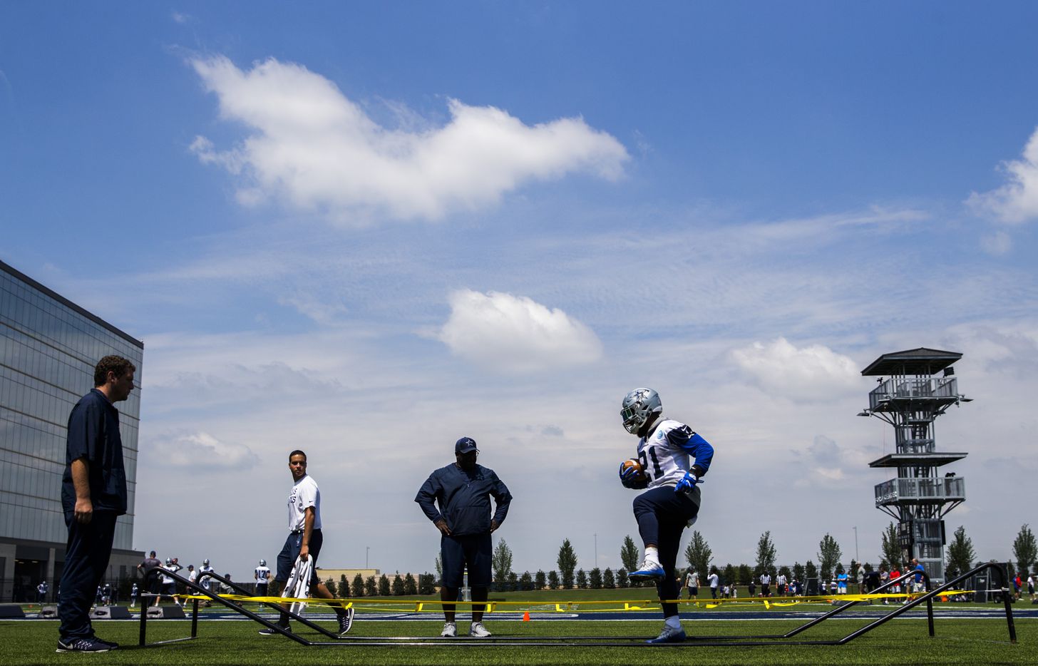 Dallas Cowboys running back Ezekiel Elliott (21) runs an agility drill during practice on Wednesday, June 7, 2017, at The Star in Frisco. 