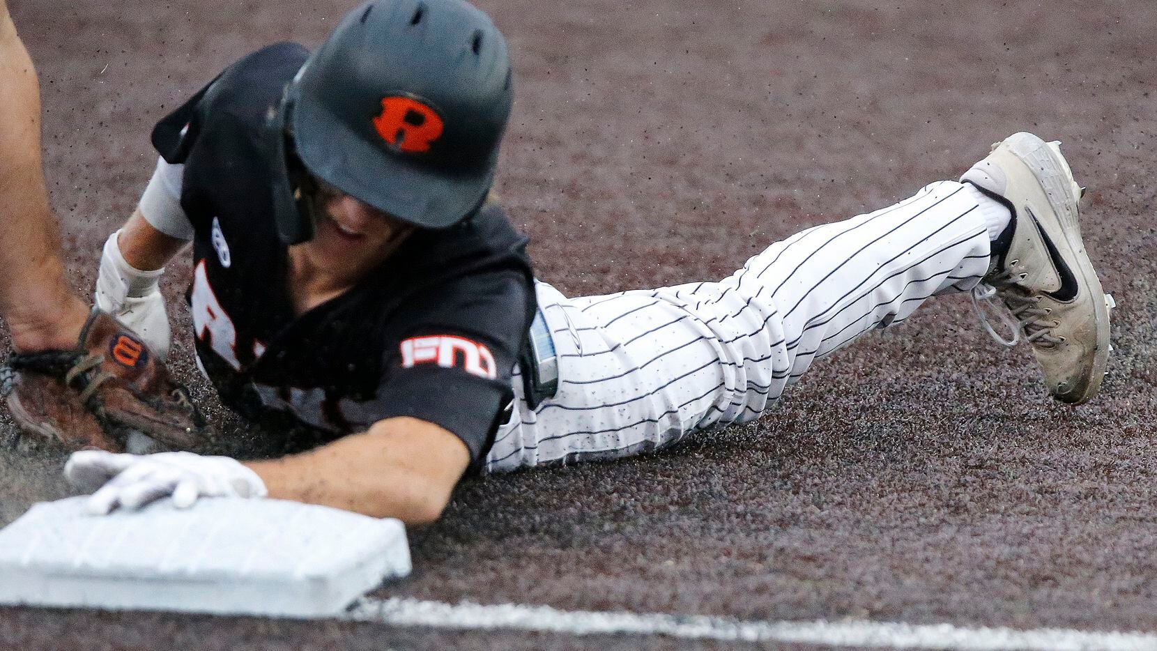 Rockwall shortstop Brayden Randle (2) was called out at third on the tag in the first inning...