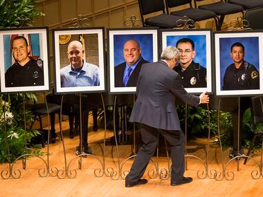 Portraits of the five law enforcement officers killed last week in an ambush at a Black...
