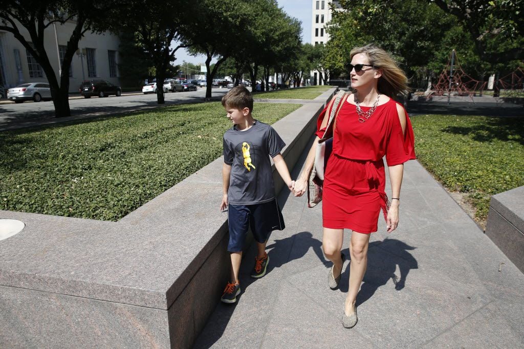 Amber Briggle walks to enter the courtroom with her transgender son Max Briggle, where a hearing for the federal lawsuit on transgender bathroom rules will be held at Eldon B. Mahon U.S. Courthouse in Fort Worth on Aug. 12, 2016.  (Nathan Hunsinger/The Dallas Morning News)