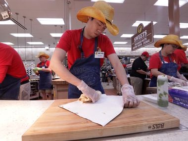 Calvin Liu makes breakfast tacos at the new Buc-ee's in Melissa, TX, on Apr. 29, 2019. 