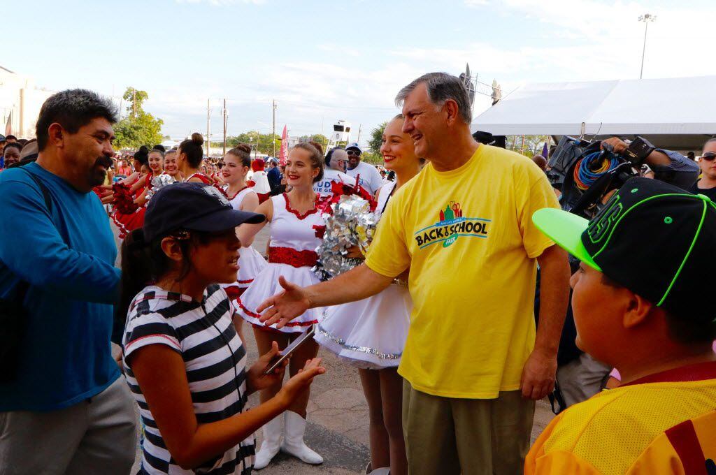Dallas Mayor Mike Rawlings greets families at the 20th annual Mayor's Back To School Fair...