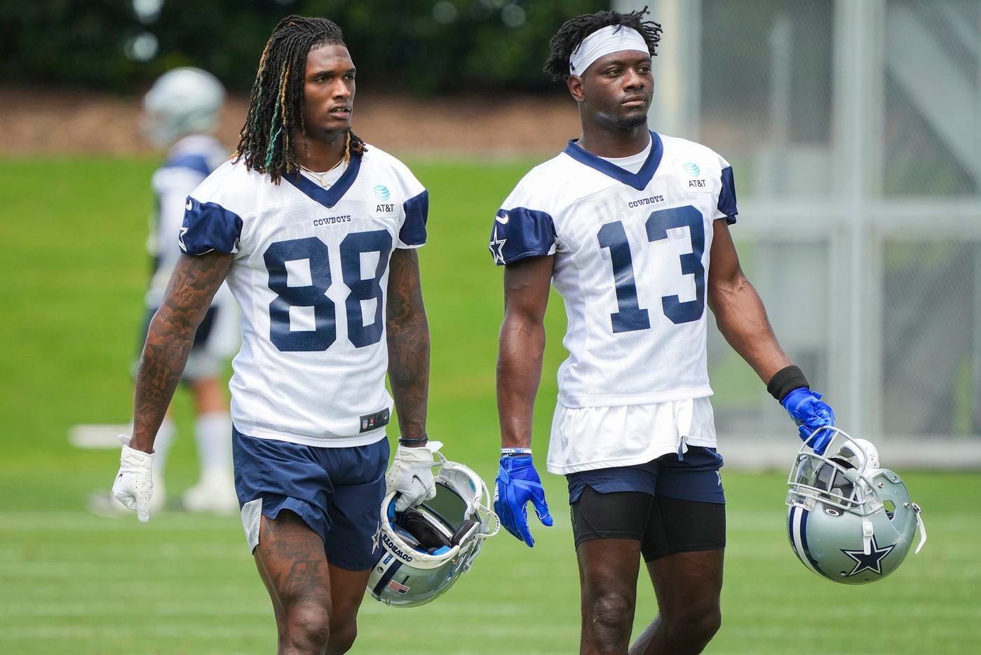 Dallas Cowboys wide receivers CeeDee Lamb (88) and Michael Gallup (13) walk between drills during a minicamp practice at The Star on Tuesday, June 8, 2021, in Frisco. (Smiley N. Pool/The Dallas Morning News)
