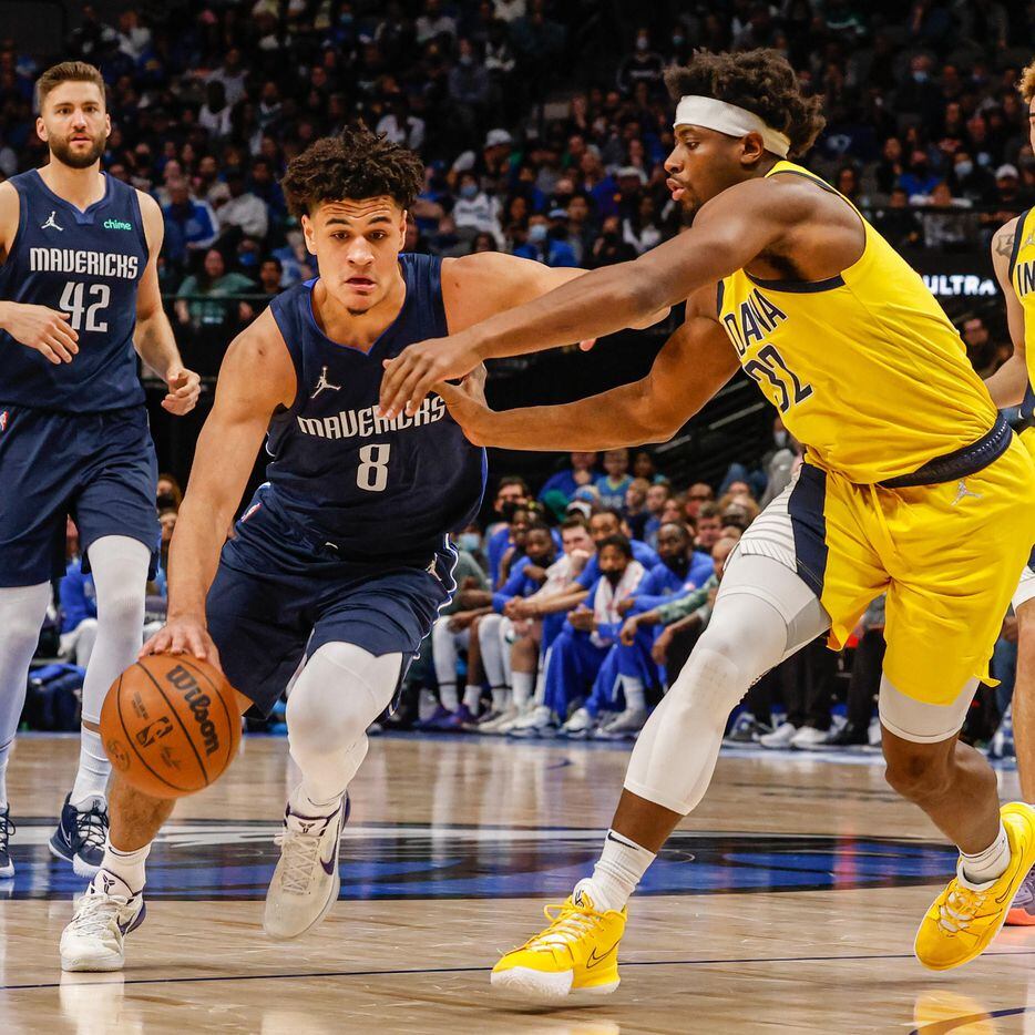 Dallas Mavericks forward George King (8) dribbles the ball next to Indiana Pacers guard Terry Taylor (32) during the second half at the American Airlines Center in Dallas on Saturday, January 29, 2022.