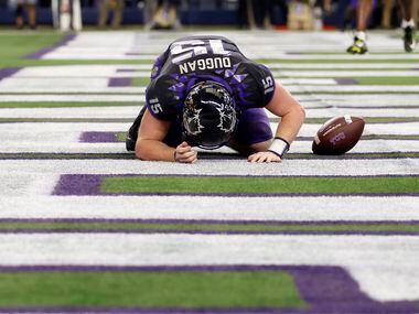 TCU Horned Frogs quarterback Max Duggan (15) is slow to get up after his fourth quarter...