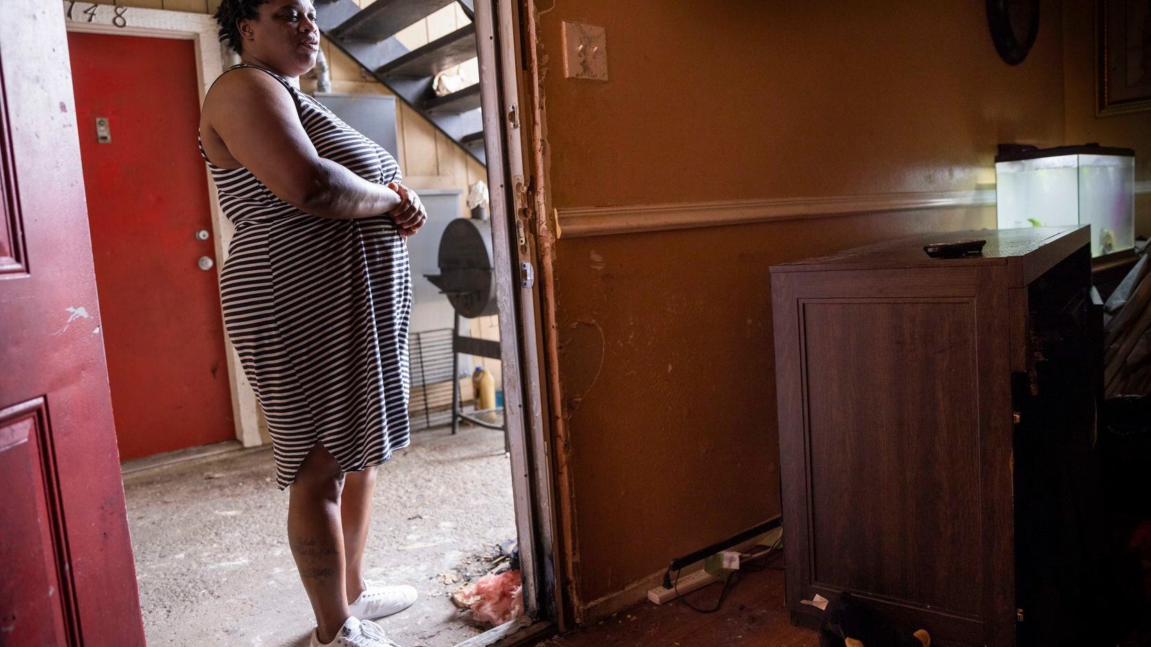 Roshunda Tilley stands at the door of her apartment, where multiple televisions were stolen...