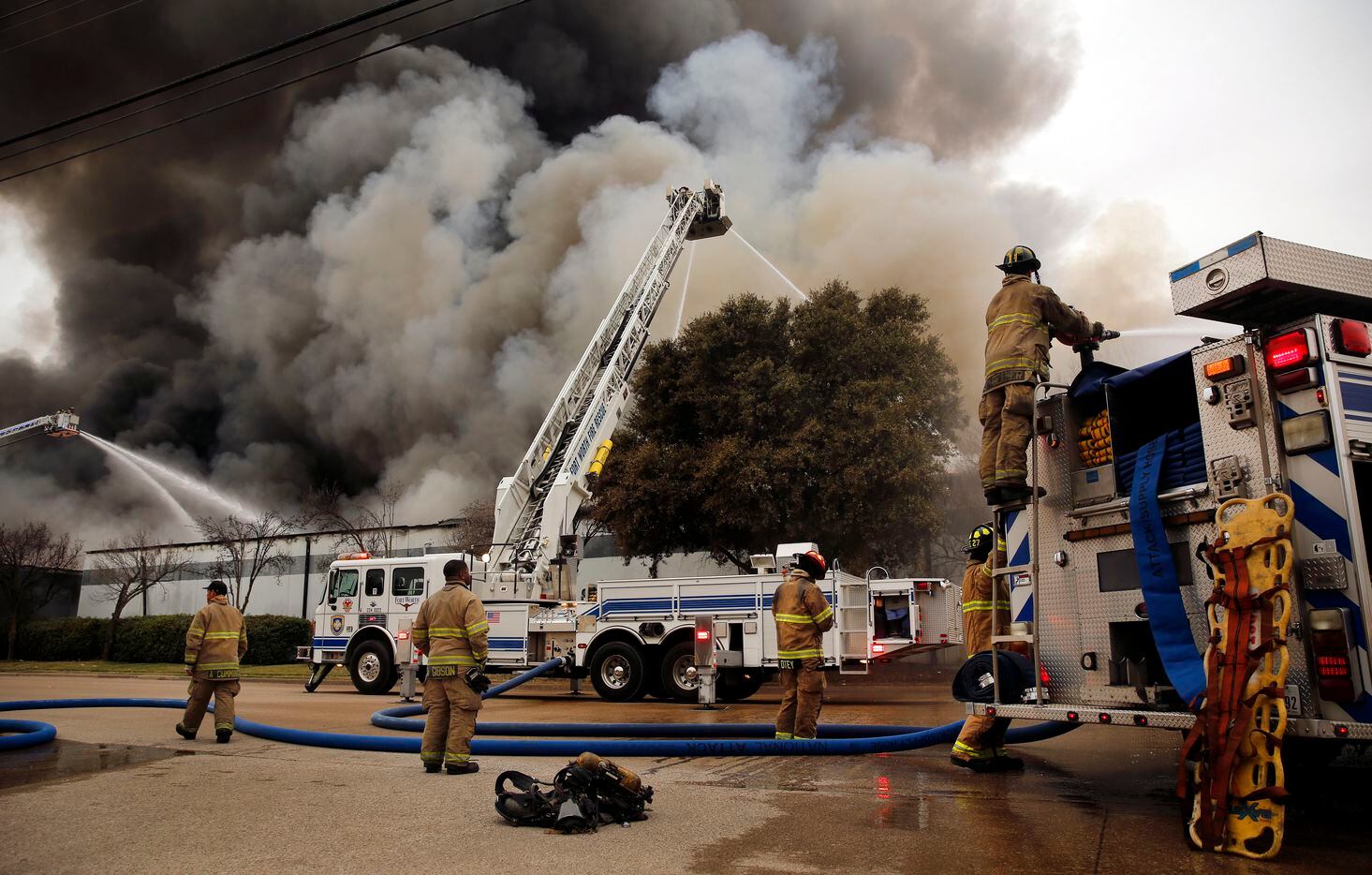 Fort Worth firefighters battle a large 5-alarm fire at the Advanced Foam Recycling facility in Richland Hills, Texas, Thursday, February 25, 2021. Advanced Foam Recycling recycles materials to be processed and used for carpet underlay, pillows, and furniture, according to the company website. Over 125 firefighters from Richland Hills, Haltom City, North Richland Hills and Fort Worth firefighters assisted on the commercial structure fire in the 2500 block of Handley Ederville Road in E. Fort Worth. (Tom Fox/The Dallas Morning News)