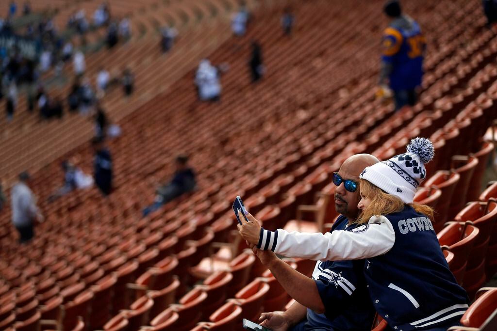 Dallas Cowboys fans Frank and Emma Gonzalez of Las Vegas take a selfie after arriving to Los...