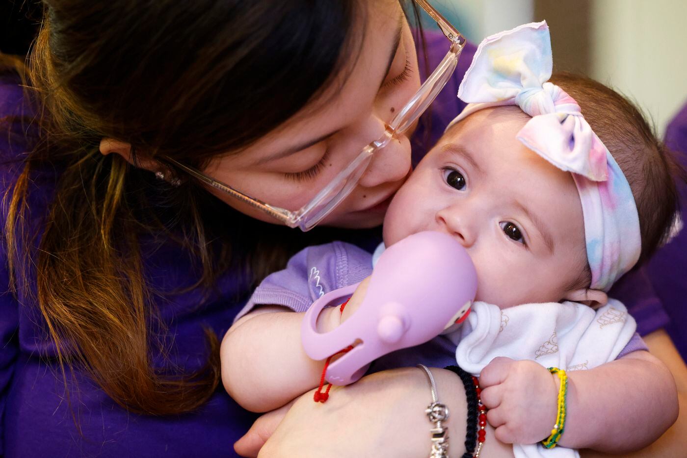Natalie Zamora, sister of late Gabriel Zamora, 14, kisses four-month-old daughter Adelina...