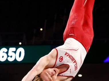 University of Oklahoma's Matt Wenske performs on the horizontal bar during Day 1 of the US...