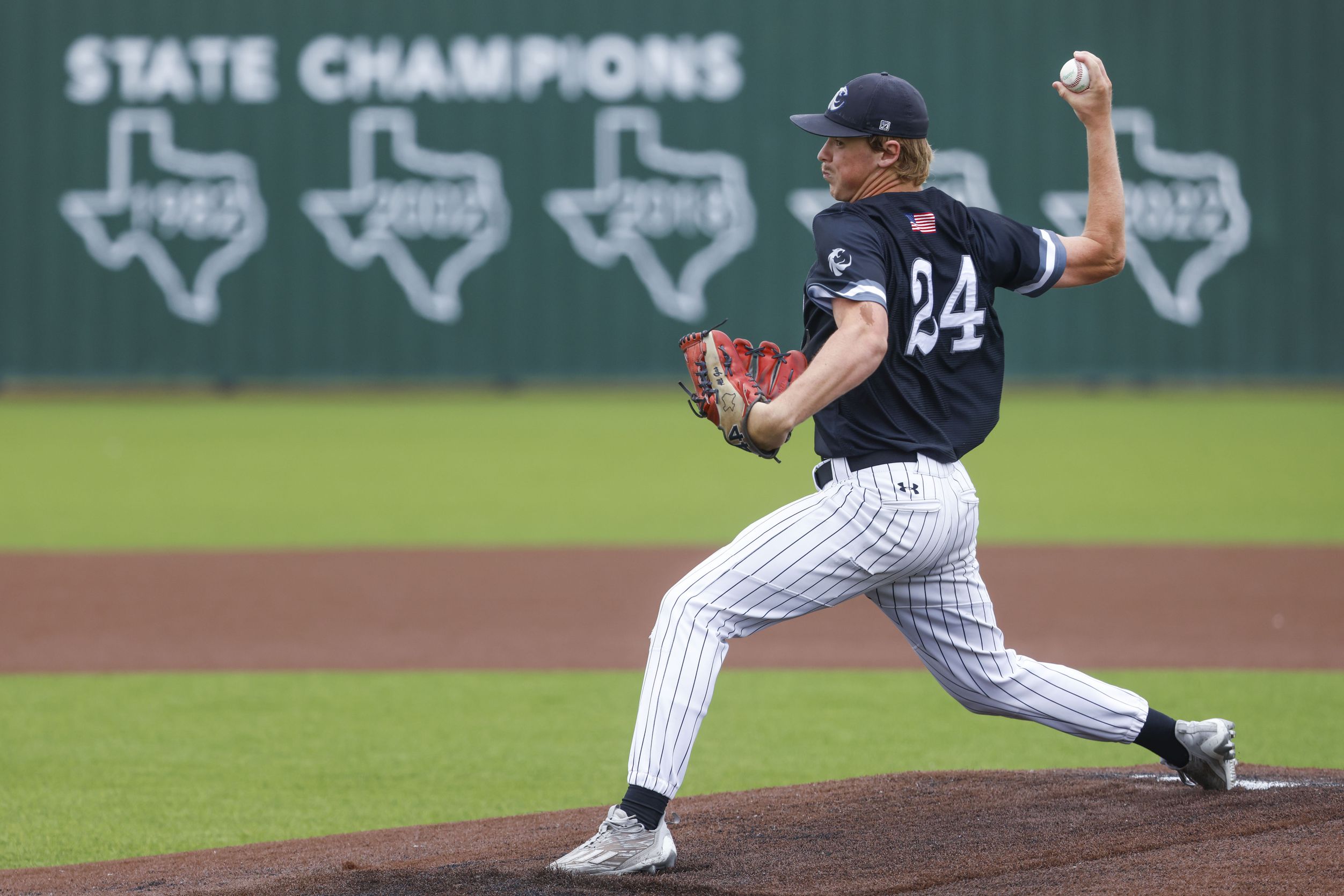 Denton Guyer’s Brad Pruett throws a pitch during the first inning of a baseball game against...