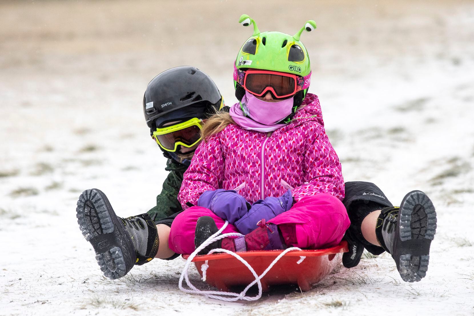 Madeline Daniel, 6, and her brother Riley, 8, played in the snow at Flag Pole Hill Park in Dallas on Feb. 14 as the area braced for even more severe weather to roll in. Their father, Matt Daniel, said he had both the sled years before when the family moved into their house, which sits on a hill. “I bought it in the middle of summer that year,” he said, laughing. “I’m glad they’re finally getting to enjoy it.”
