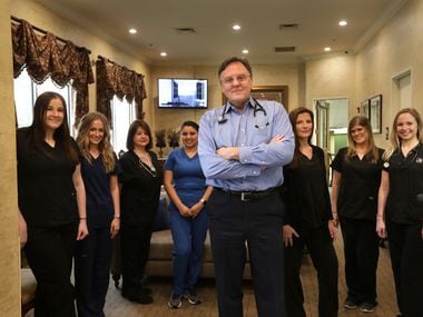 Dr. Guy Culpepper, seen here with some of his staff, has furloughed 70 employees at Bent Tree Family Physicians in Frisco and North Dallas. Revenue has fallen sharply during the coronavirus. (Jason Janik/Special Contributor)