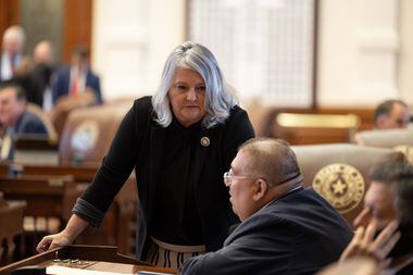 State Rep. Kronda Thimesch confers with Rep. Ryan Guillen during a special session of the...