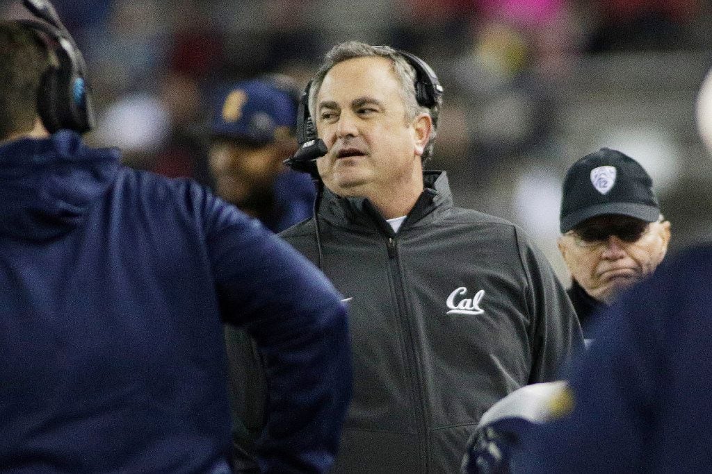 California head coach Sonny Dykes, center, walks along the sideline during the first half of...