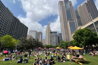 Eclipse watchers gathered at downtown Dallas' Main Street Garden on Monday, April 8.