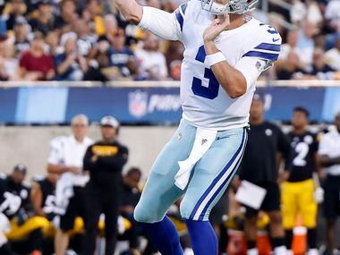 Dallas Cowboys quarterback Garrett Gilbert (3) throws a pass after rolling out of the pocket...