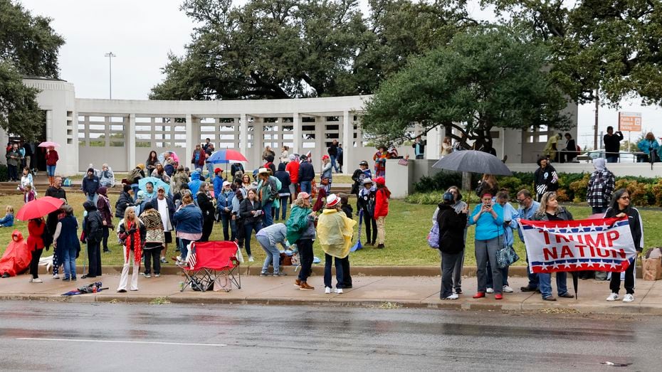 QAnon supporters gather along Elm Street at Dealey Plaza in downtown Dallas on November 2, 2021. The group believes John F. Kennedy Jr., who died in a plane crash in 1999, will return and reinstate Donald Trump as president.  (Elias Valverde II / The Dallas Morning News)