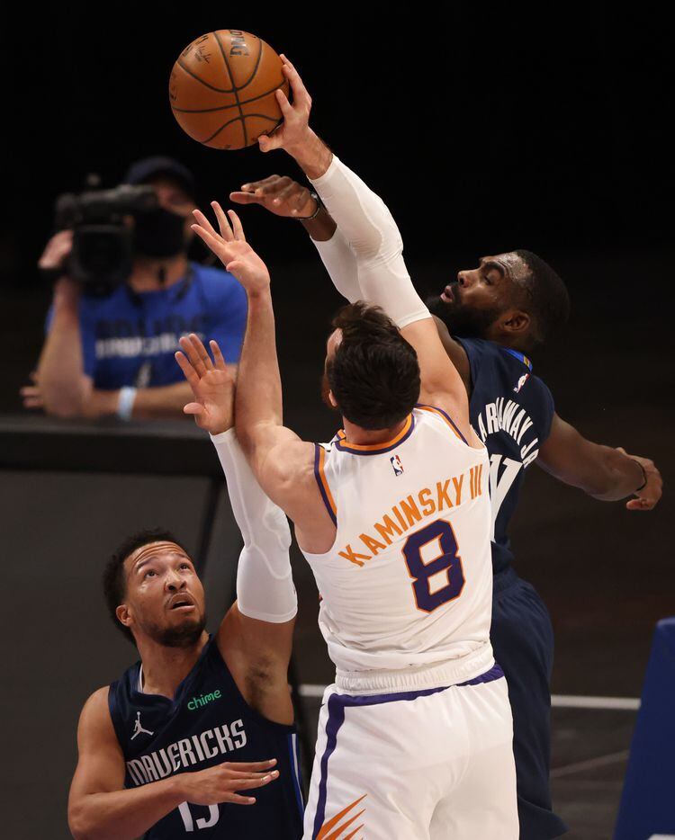 Dallas Mavericks forward Tim Hardaway Jr. (11) blocks a shot attempt from Phoenix Suns...