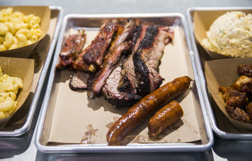 Ribs, brisket and sausage are ready for pickup at Heim Barbecue's new location on Saturday,...