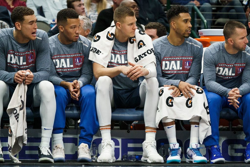 Dallas Mavericks forward Kristaps Porzingis (center) watches from the bench during the first half of an NBA basketball game against the New York Knicks at American Airlines Center on Friday, Nov. 8, 2019, in Dallas. (Smiley N. Pool/The Dallas Morning News)