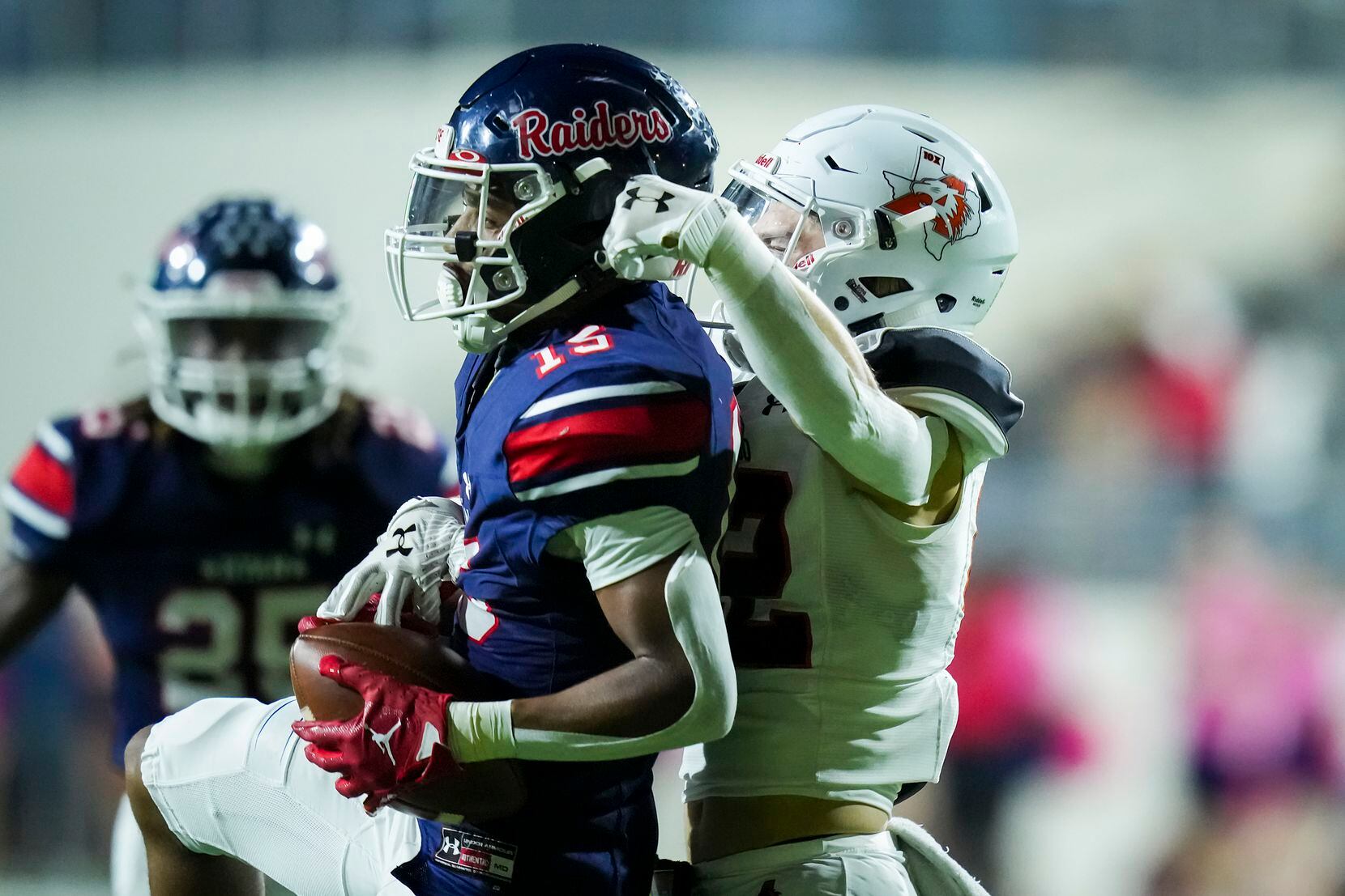 Denton Ryan defensive back Trae Williams (15) intercepts a pass intended for Aledo wide...