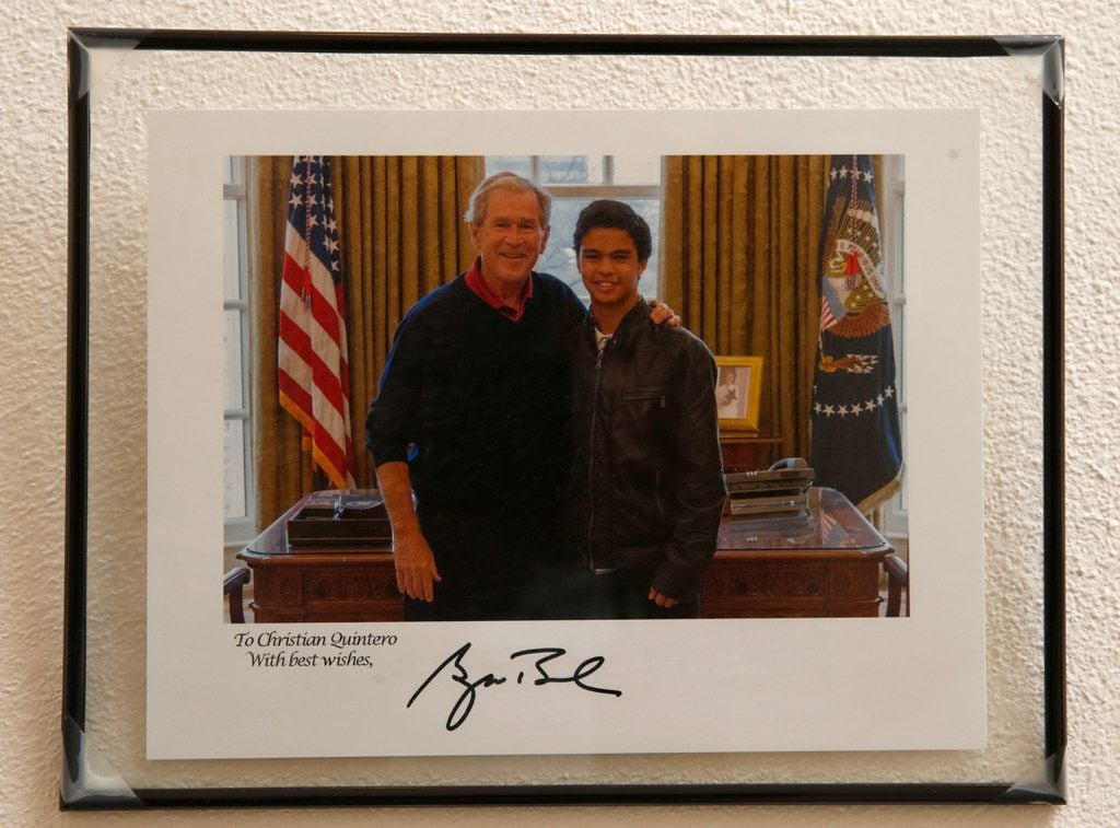 Copy photo of Christian Quintero with former President George Bush in a photo on the wall of...