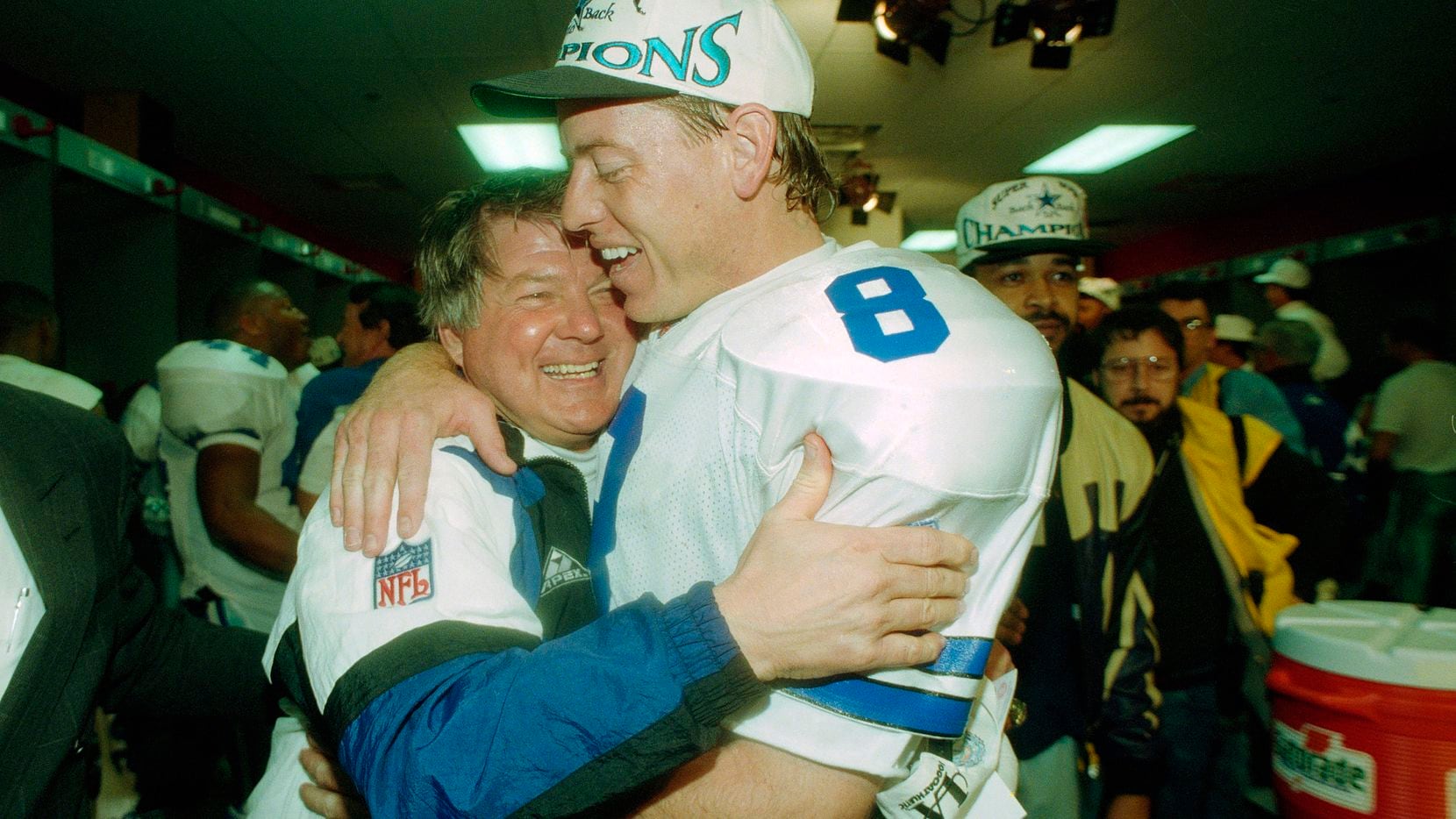 In this Jan. 30, 1994, file photo, Dallas Cowboys' head coach Jimmy Johnson hugs quarterback...