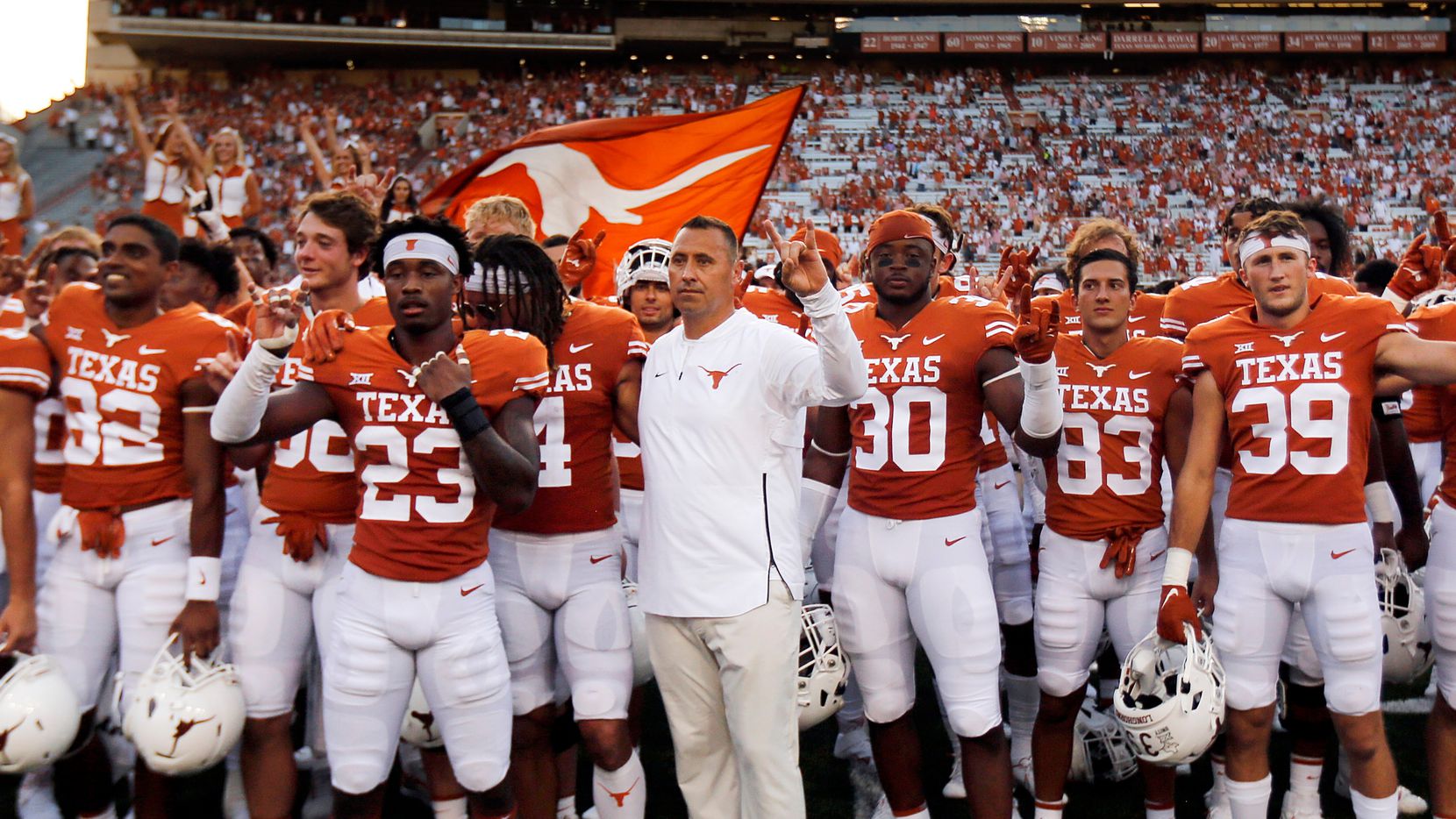 Texas Longhorns head coach Steve Sarkisian (center) and his players sing 'The Eyes of Texas' following their win over the Louisiana-Lafayette Ragin Cajuns at DKR-Texas Memorial Stadium in Austin, Saturday, September 4, 2021. (Tom Fox/The Dallas Morning News) 