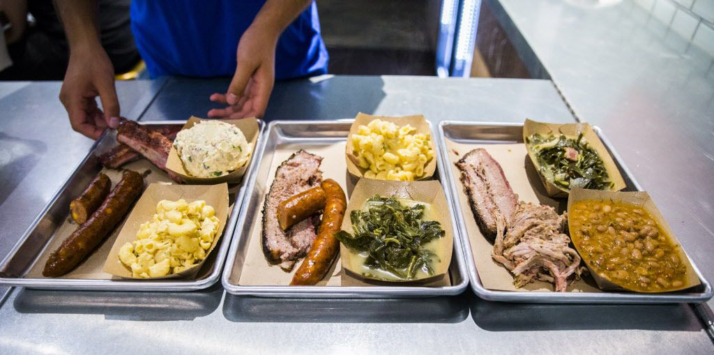 Three combo platters are served at Heim Barbecue's new location on Saturday, August 6, 2016...