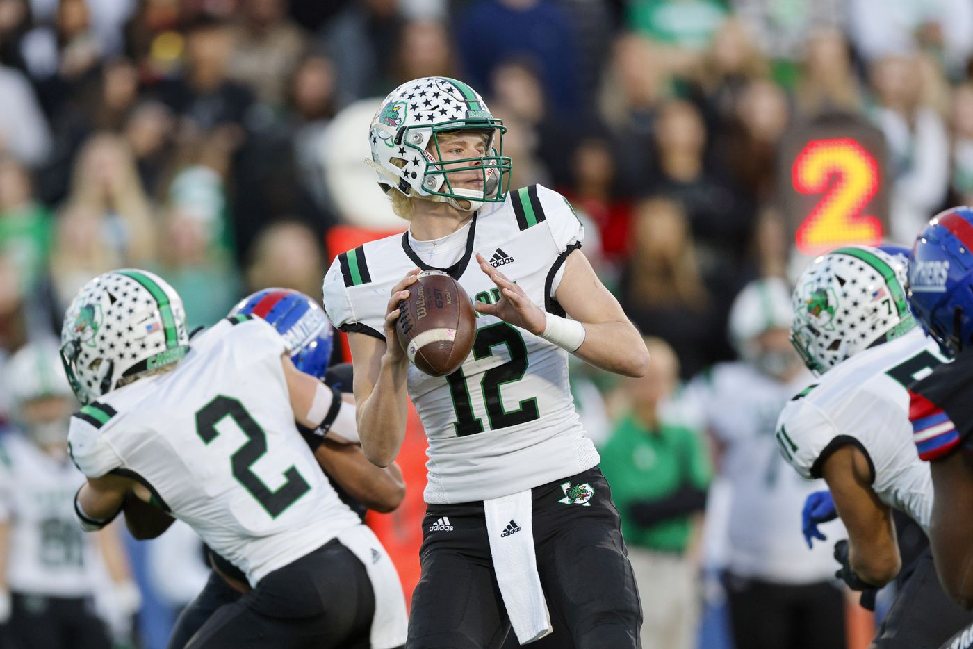 Southlake Carroll quarterback Kaden Anderson (12) looks to pass during the first half of their Class 6A Division I state semifinal playoff game against Duncanville at McKinney ISD Stadium in McKinney, Texas, Saturday, Dec. 11, 2021. (Elias Valverde II/The Dallas Morning News)