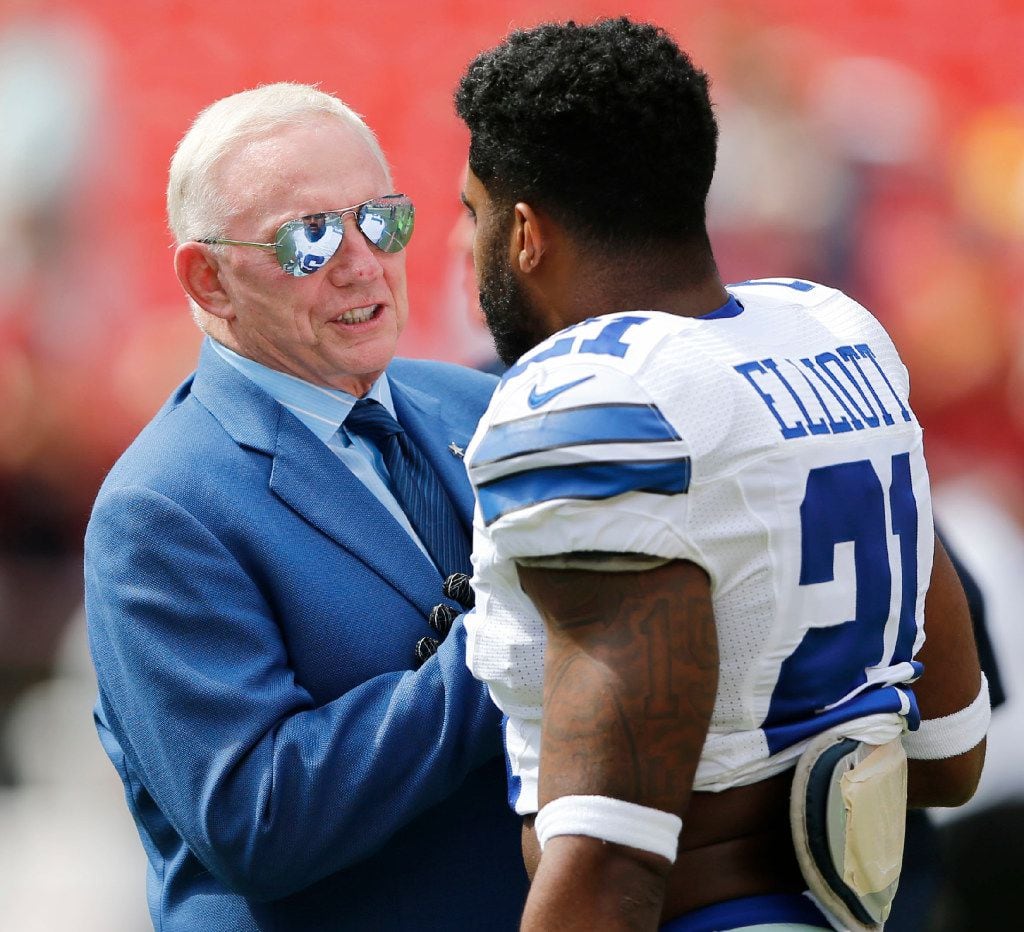Dallas Cowboys owner and general manager Jerry Jones talks with Dallas Cowboys running back Ezekiel Elliott (21)  before a game between the Dallas Cowboys and Washington Redskins at FedEx Field in Landover, Maryland on Sunday, September 18, 2016. (Vernon Bryant/The Dallas Morning News) ORG XMIT: DMN1609181204002094