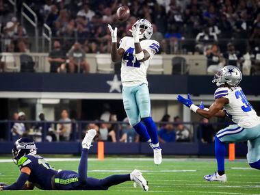 Dallas Cowboys safety Markquese Bell (41) intercepts a pass intended for Seattle Seahawks...