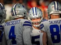 Dallas Cowboys guard Connor Williams (52) leans into the huddle during the first half of an NFL Wild Card playoff football game against the San Francisco 49ers at AT&T Stadium on Sunday, Jan. 16, 2022, in Arlington.