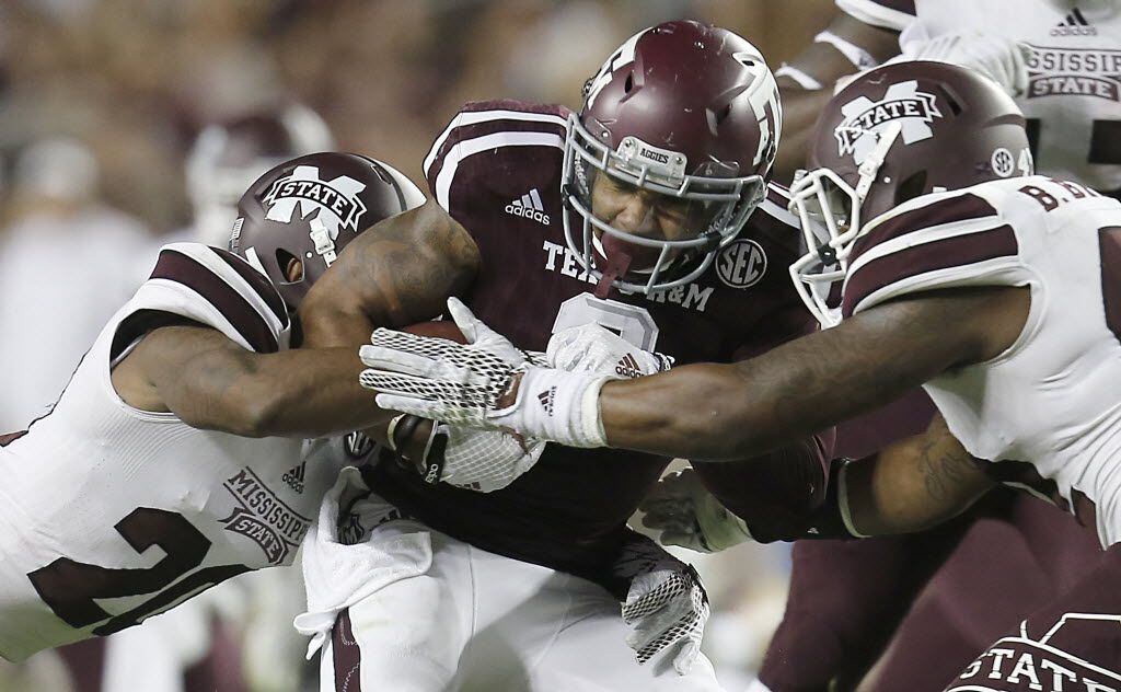 COLLEGE STATION, TX - OCTOBER 03: Christian Kirk #3 of the Texas A&M Aggies is tackled by...