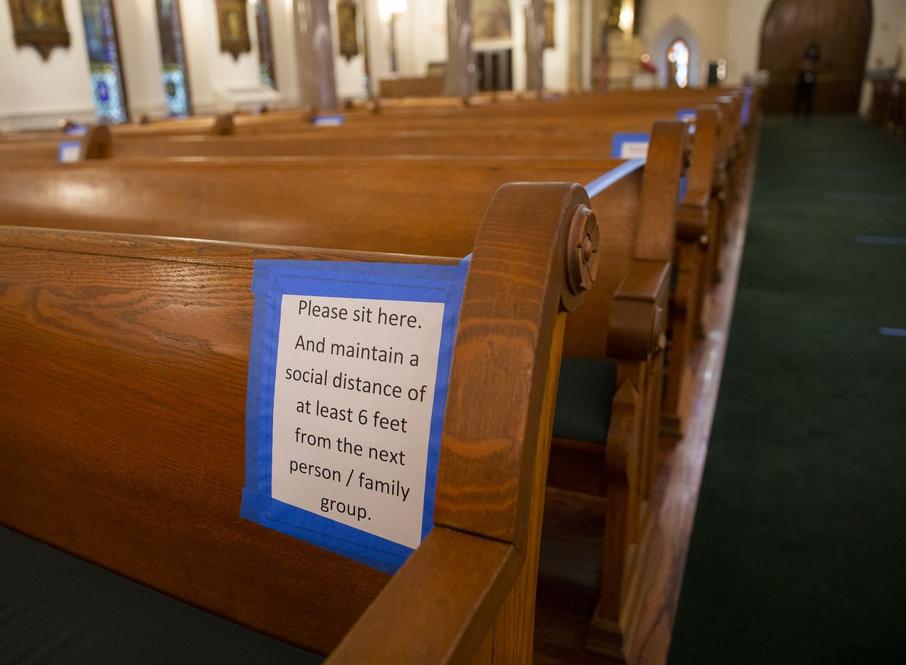 Signs and tape ensuring parishioners stay separated at St. Patrick Cathedral. The Catholic...