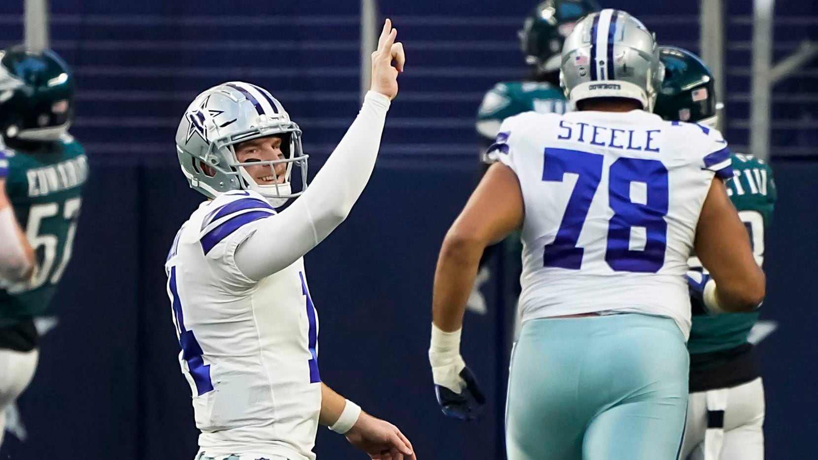 Dallas Cowboys quarterback Andy Dalton (14) celebrates after throwing a touchdown pass to...