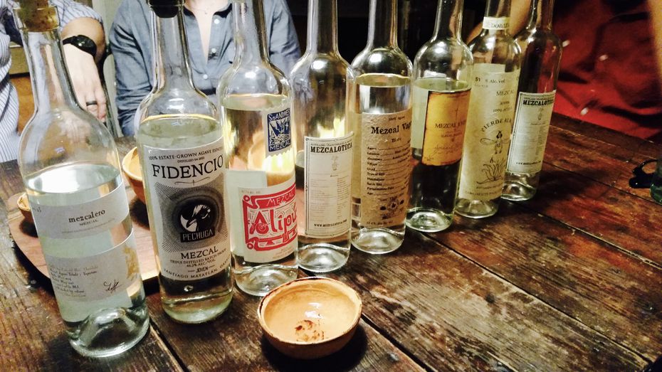 At typical table-top spread at a home tasting of the so-called "Mezcal Cartel," a group of...