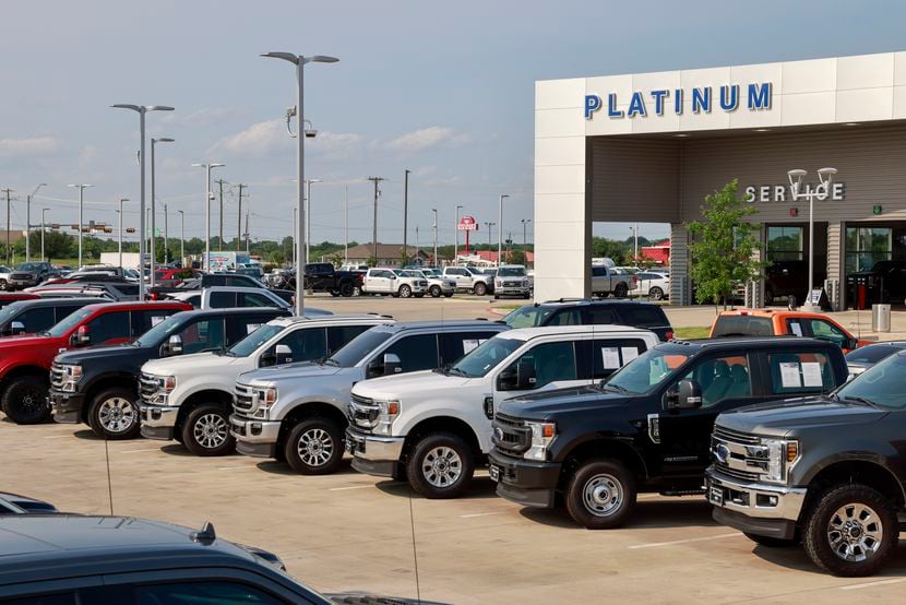 Ford pickup trucks sit outside at Platinum Ford in Terrell, Texas Monday, May 16, 2022.