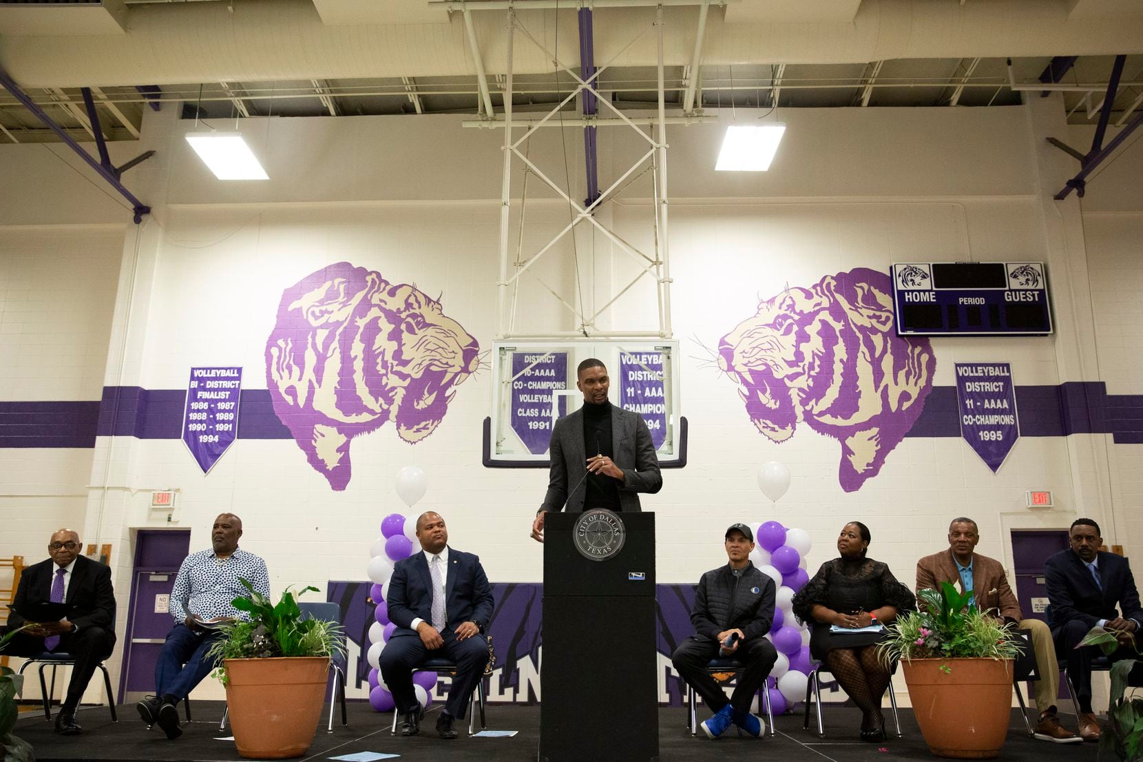 NBA Hall-of-Famer and Dallas native, Chris Bosh, (center), speaks at his alma mater, Lincoln...