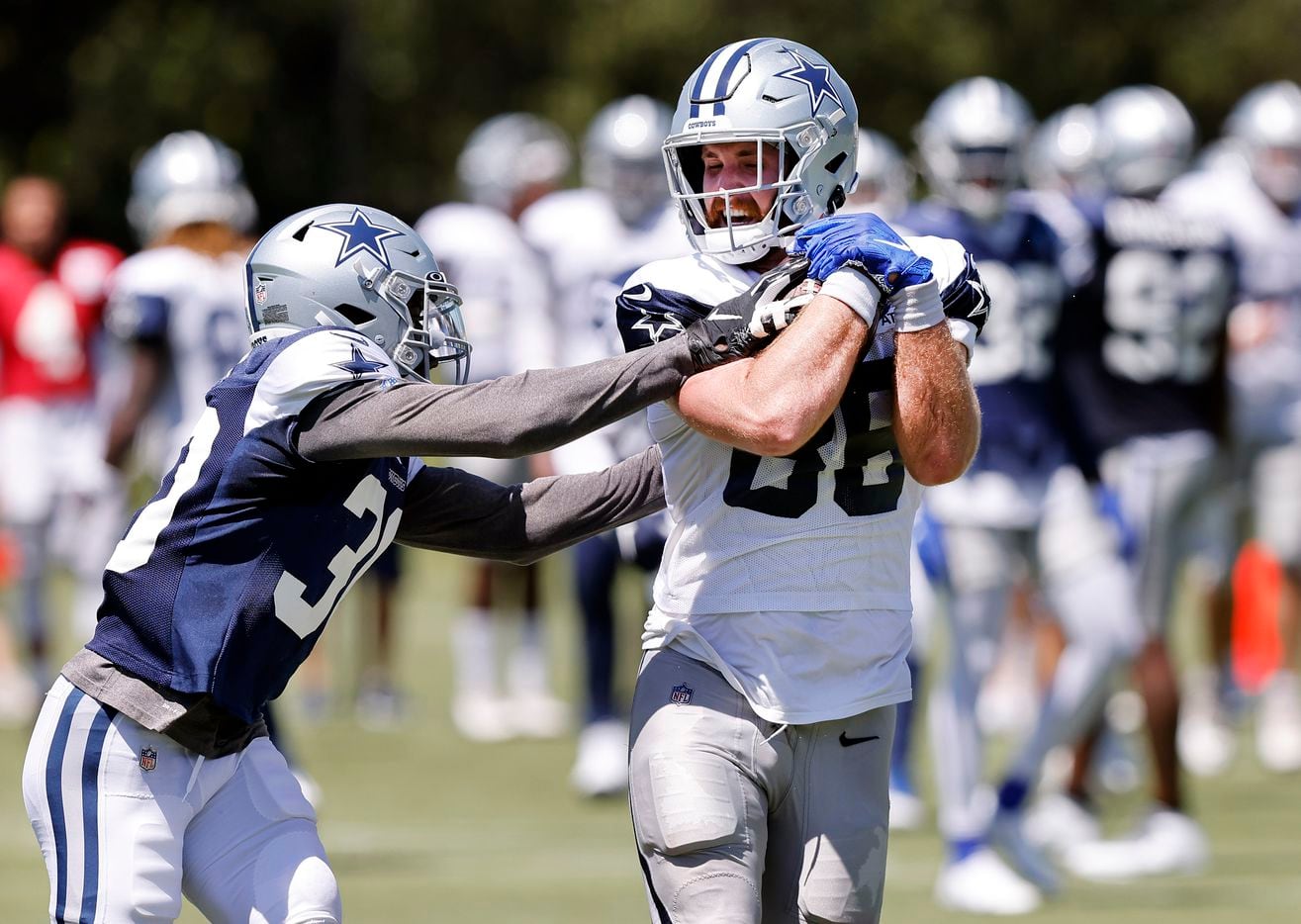Dallas Cowboys tight end Dalton Schultz (86) fights off cornerback Anthony Brown (30) after making a long pass completion during Training Camp practice at The Star in Frisco, Texas, Tuesday, August 24, 2021.(Tom Fox/The Dallas Morning News)