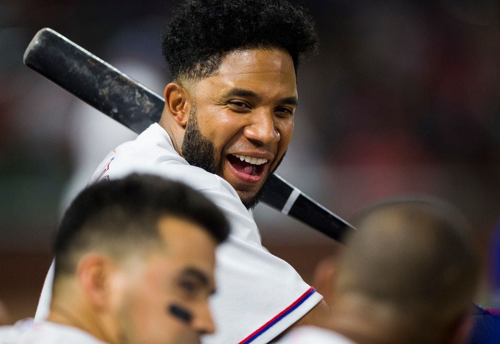Texas Rangers shortstop Elvis Andrus (1) jokes with his team mates in the dugout during the...