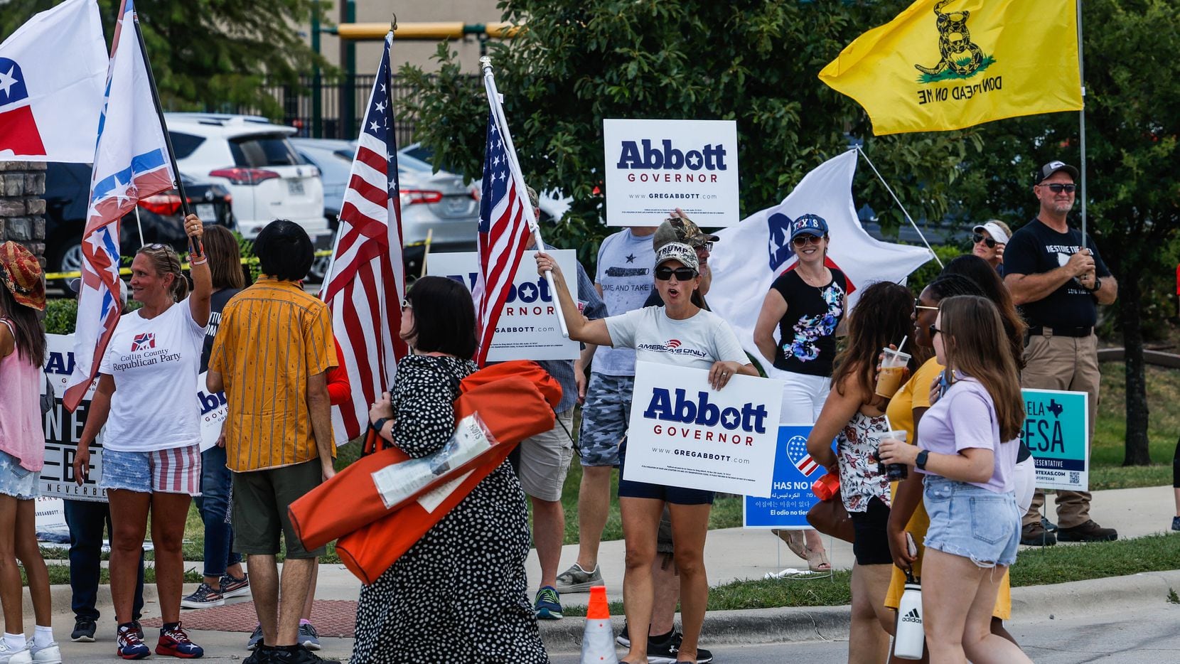 Supporters of Texas Gov. Greg Abbott gathered outside the Frisco venue where his Democratic...