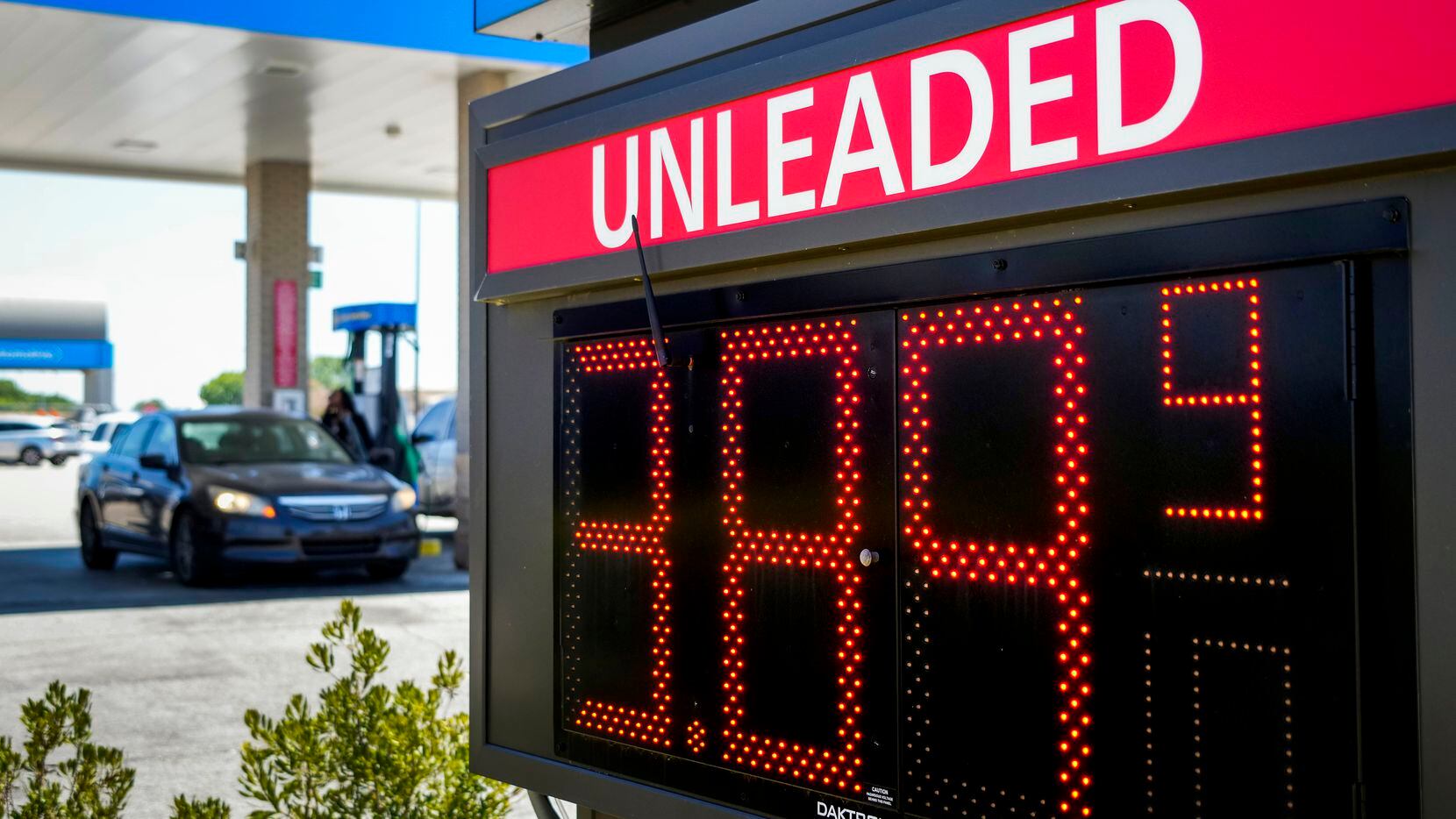 A sign advertises a price of $3.89.9 for unleaded gasoline at a Walmart in the 4800 block of...