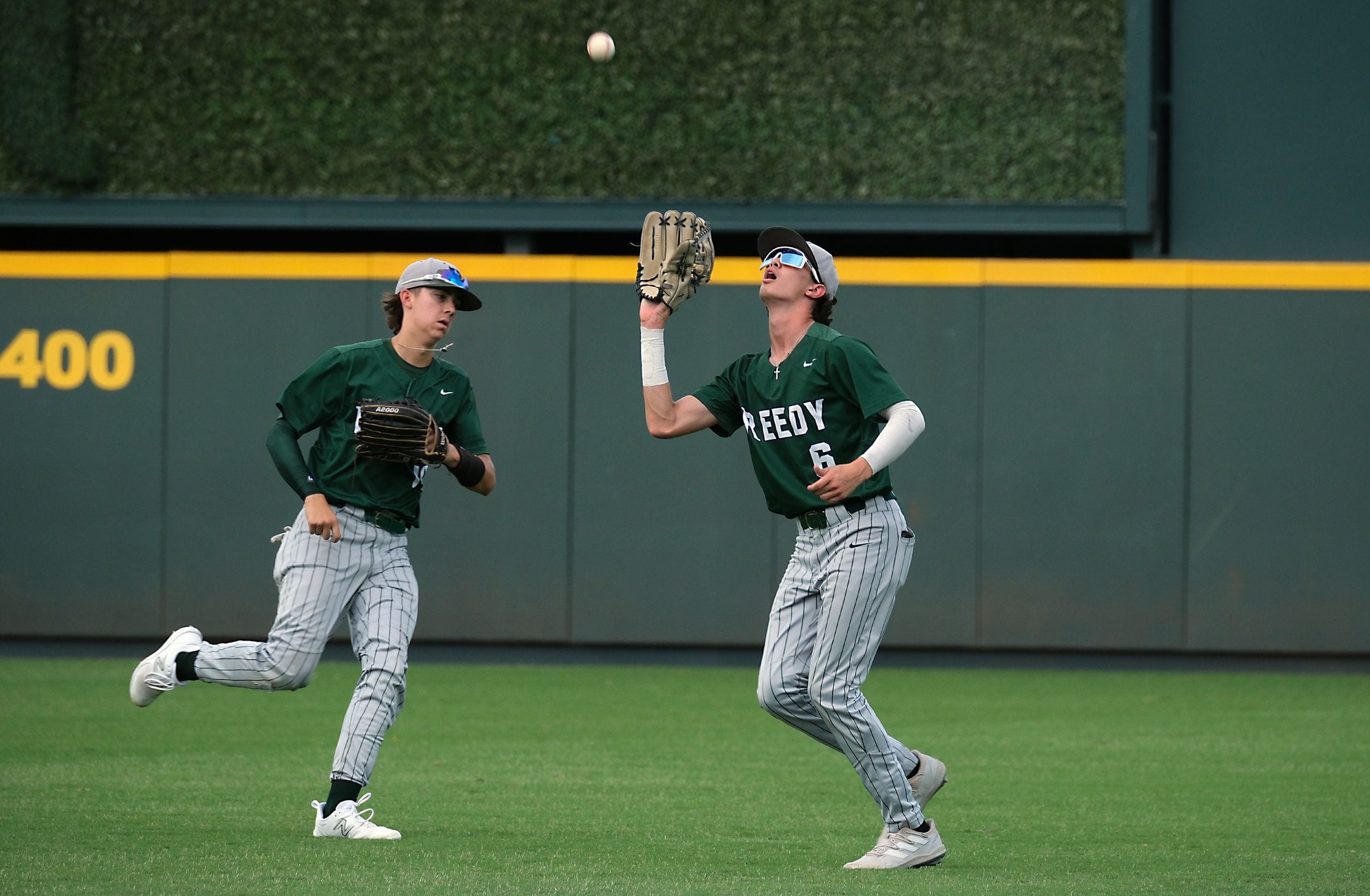 Frisco Reedy Ethan Downum, (6), catches a pop up by Magnolia West Brandon Seidmeyer, (7), in...