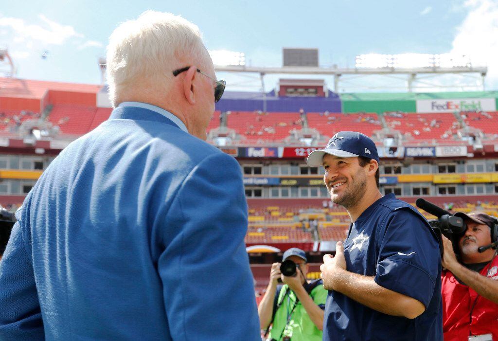 Dallas Cowboys owner and general manager Jerry Jones talks with Dallas Cowboys quarterback...