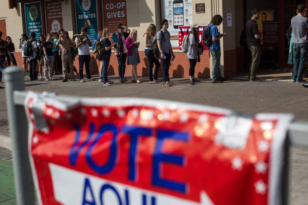 Voters wait in line to cast their ballots in Austin in last March's primary.