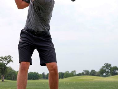 Marcus golfer Trevor Algya practices his swing on the driving range at Bridlewood Golf Club...