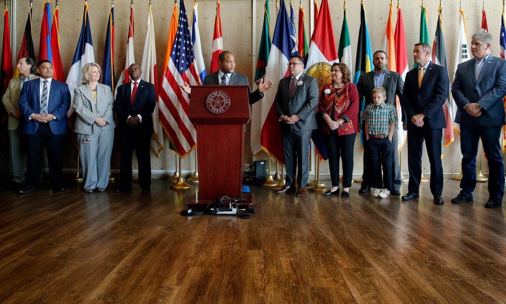 The Dallas City Council along with Mayor Eric Johnson (at podium) celebrated a unanimous...